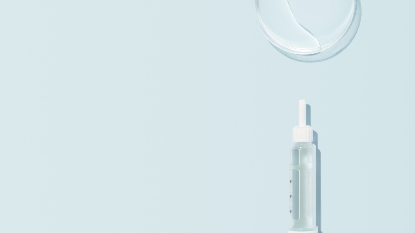 Minimal clinical syringe representing peptide therapy protocols for women over 40
